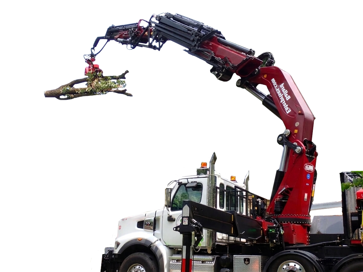 Grapple truck employed by Ballard Enterprises for reliable tree care services.