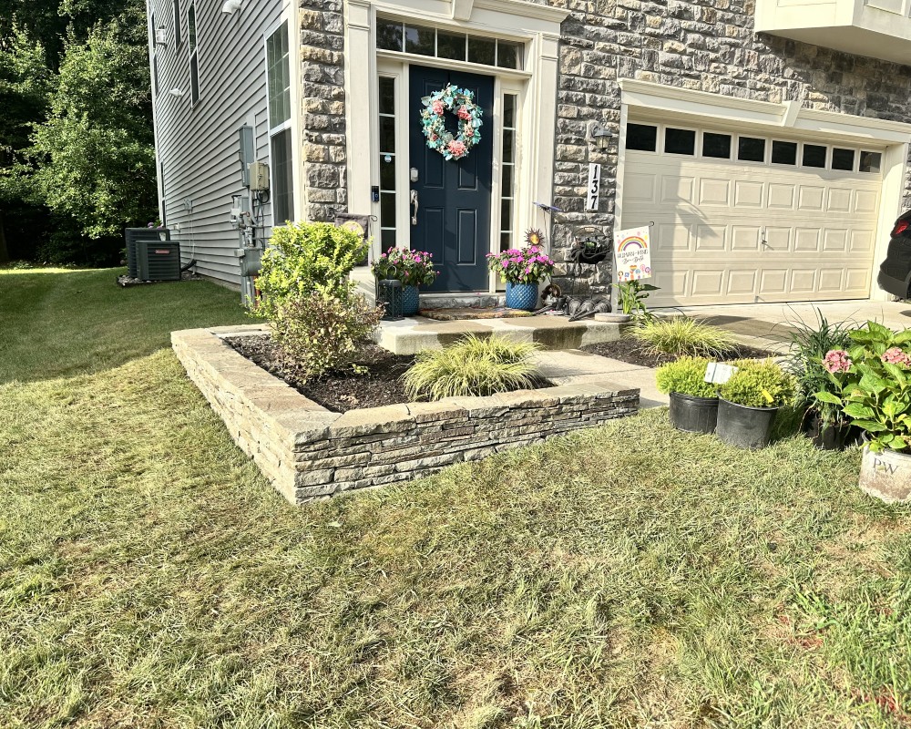 Beautifully landscaped garden showcasing vibrant flowers and lush greenery in Bowie, Maryland.