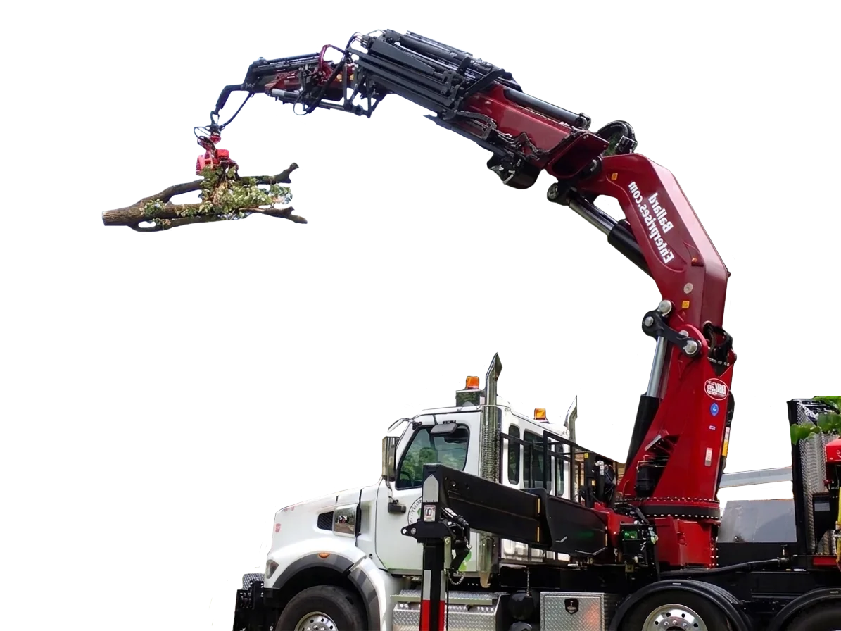 Grapple truck employed by Ballard Enterprises for reliable tree care services.